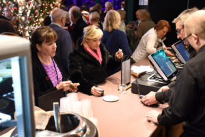 christmas show attendees being served at till
