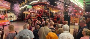 people observing steam engine